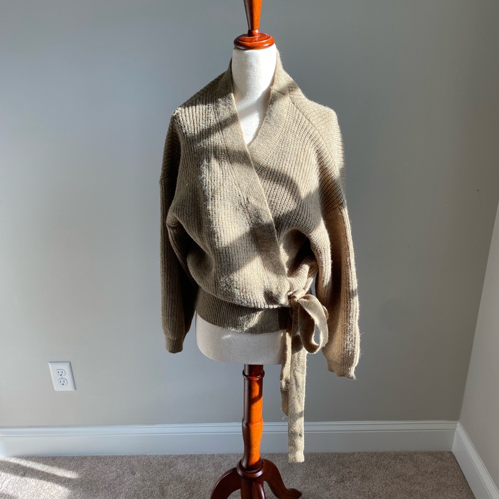 Wrap sweater with mild signs of wear.